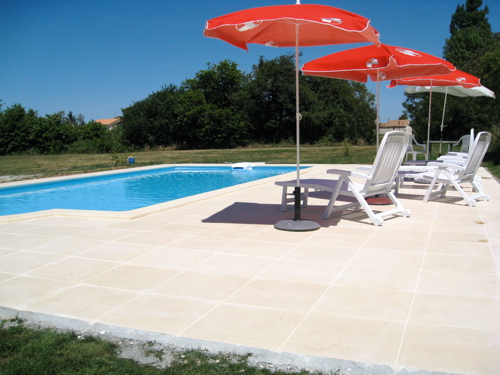 Large swimming pool terrace at gites in France